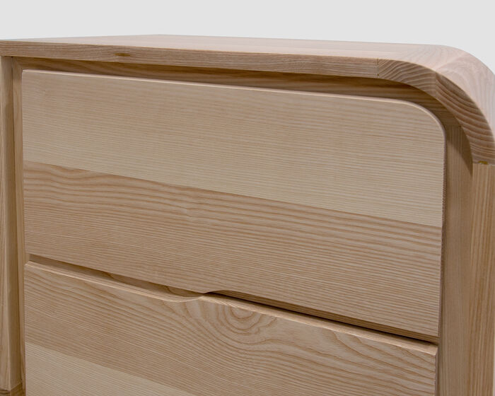 Two-drawer nightstand in solid ash wood. Contemporary design and artisanal craftsmanship.